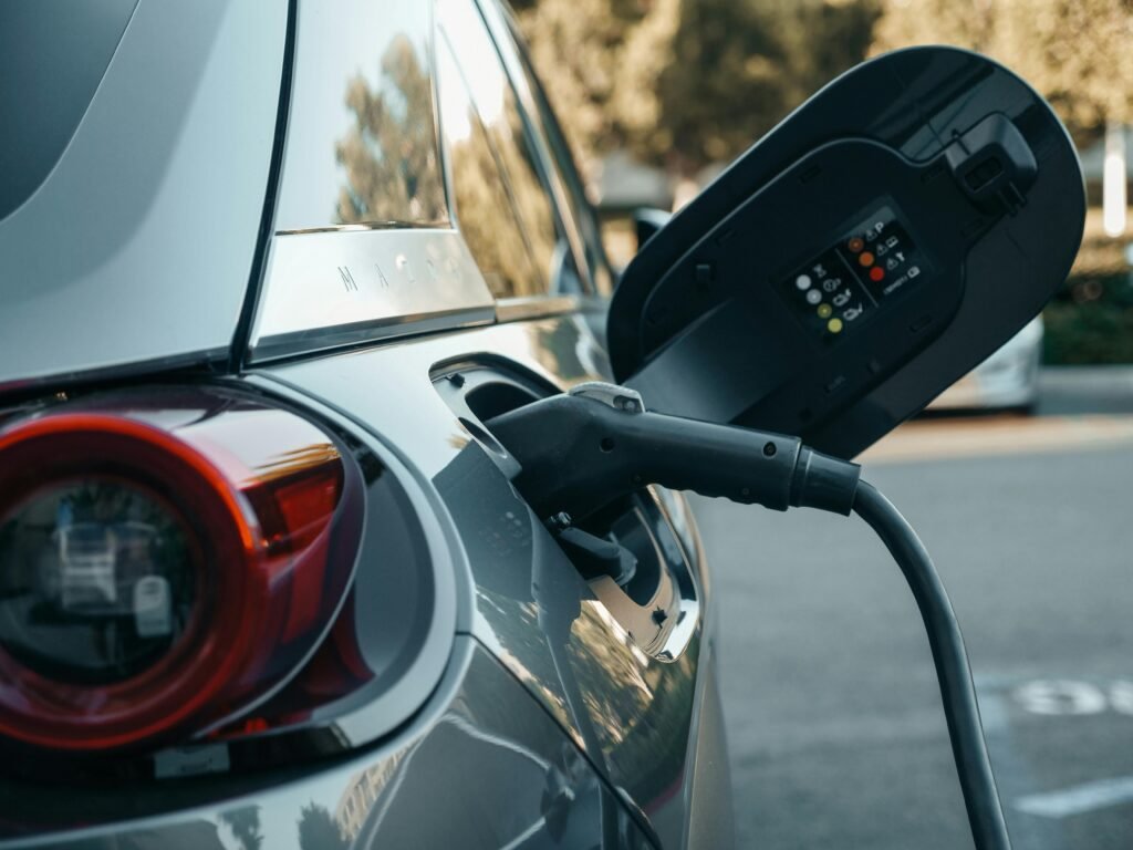 Automobile: All the Stats, Facts, and Data You'll Ever Need to Know Close-up of an electric vehicle being charged, highlighting modern clean energy technology.